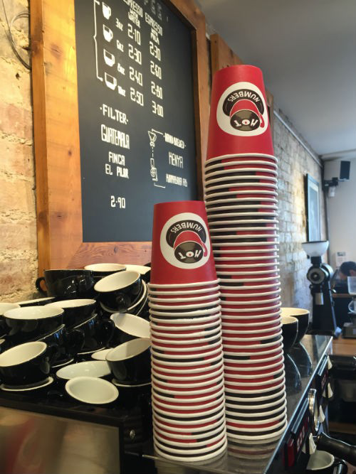 Branded Paper Cups On Coffee Machine