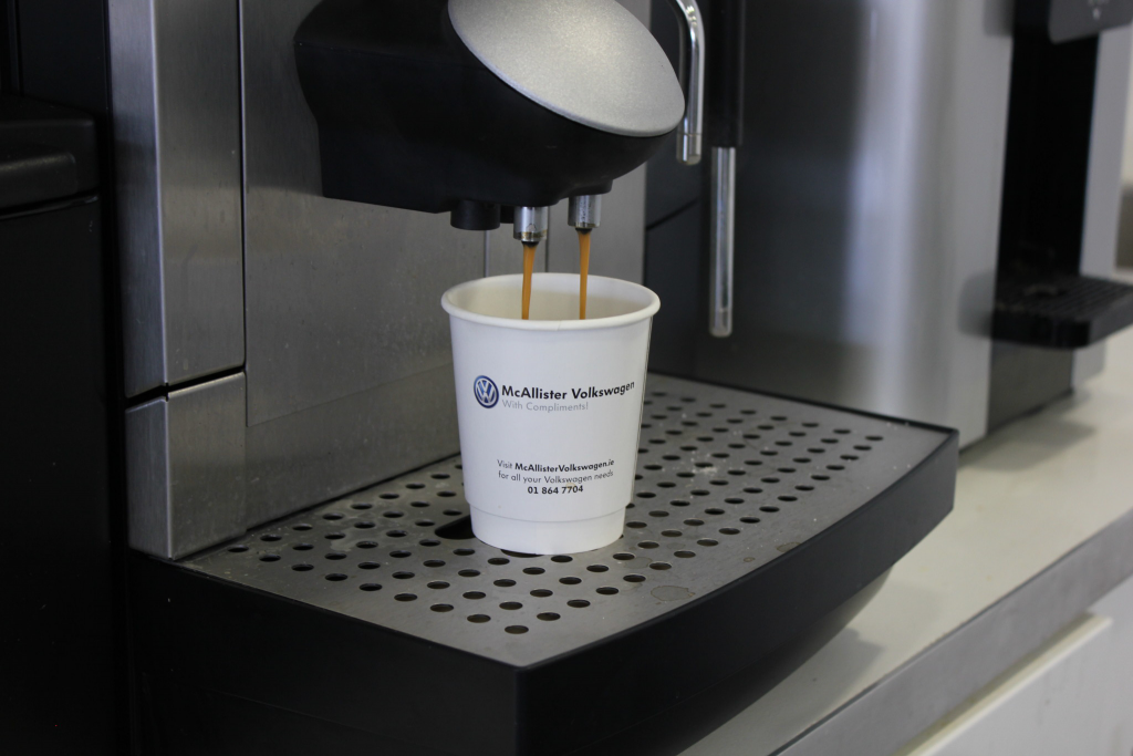 Paper-Cup-Factory-branded-paper-cup-being-used-at-a-local-car-dealership-coffee-machine